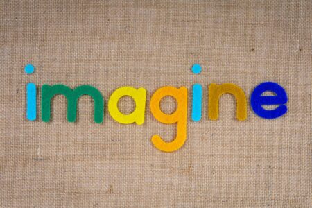 the word imagine on a woven surface